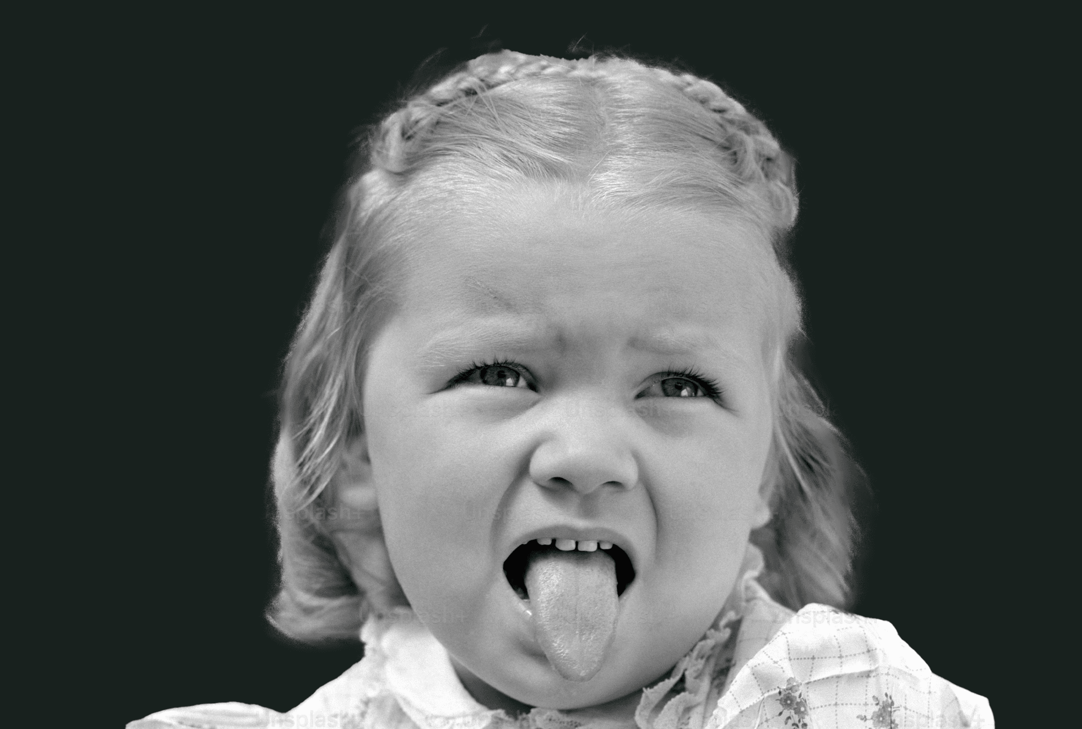 Technician washing a trash bin with high-pressure equipment.
